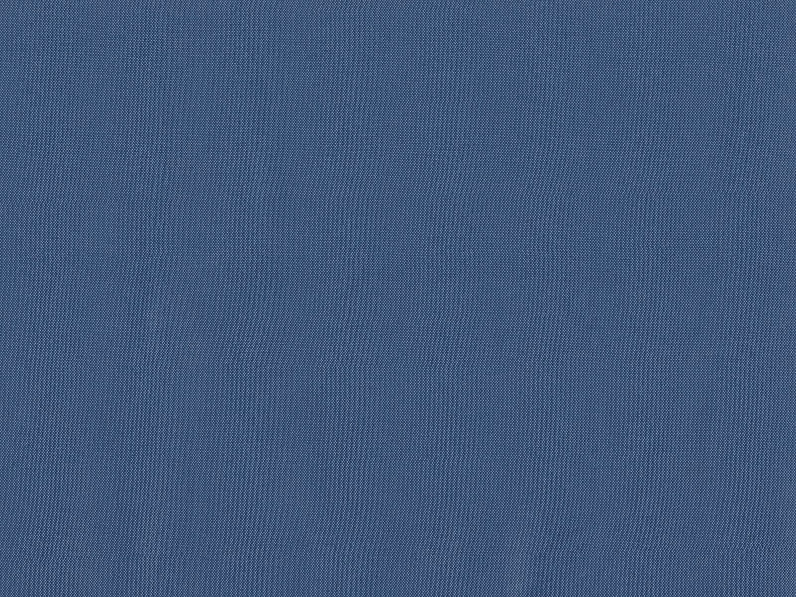 Muted slate-blue flat weave with subtle tonal variation across the surface