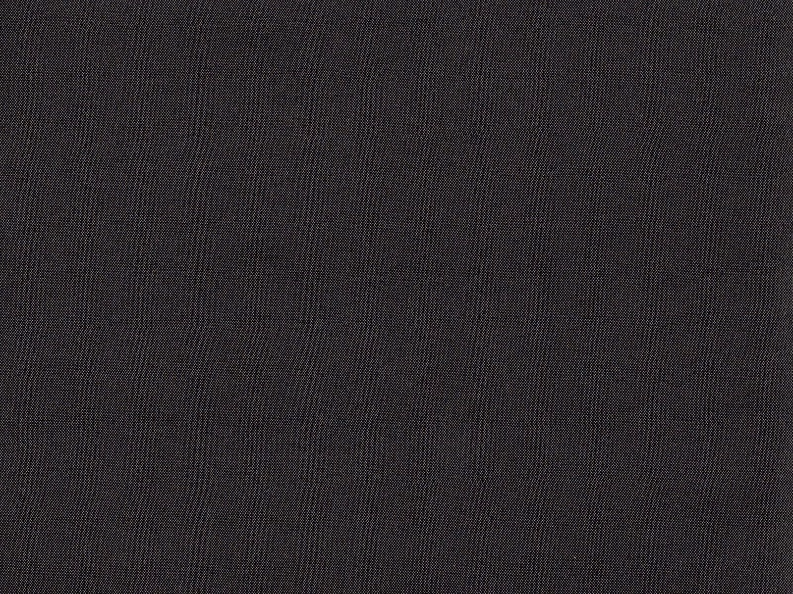 Near-black charcoal flat weave showing a fine, subtly mottled textile surface