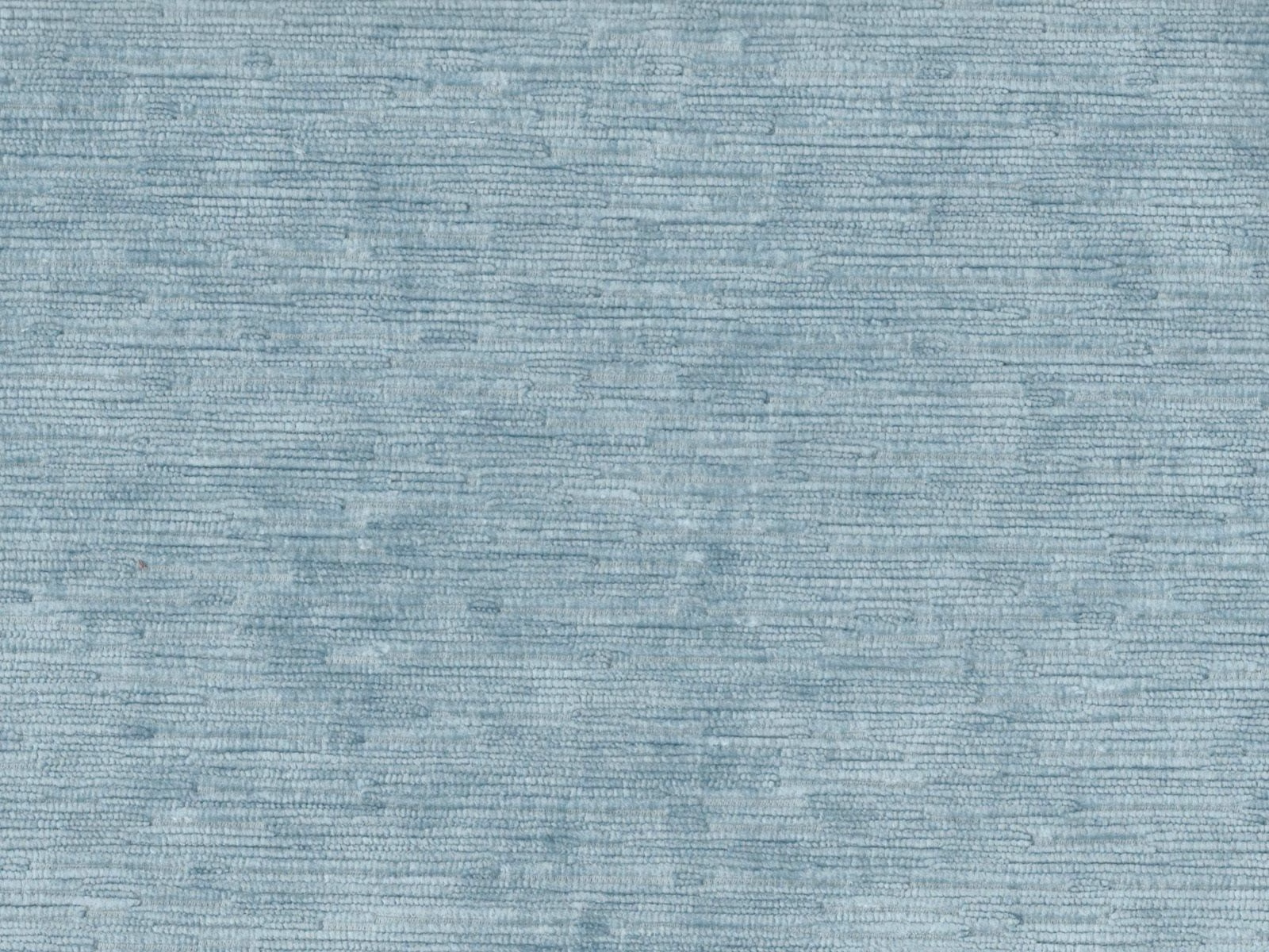 Close-up of muted aqua-blue velvet with fine horizontal greyed striations