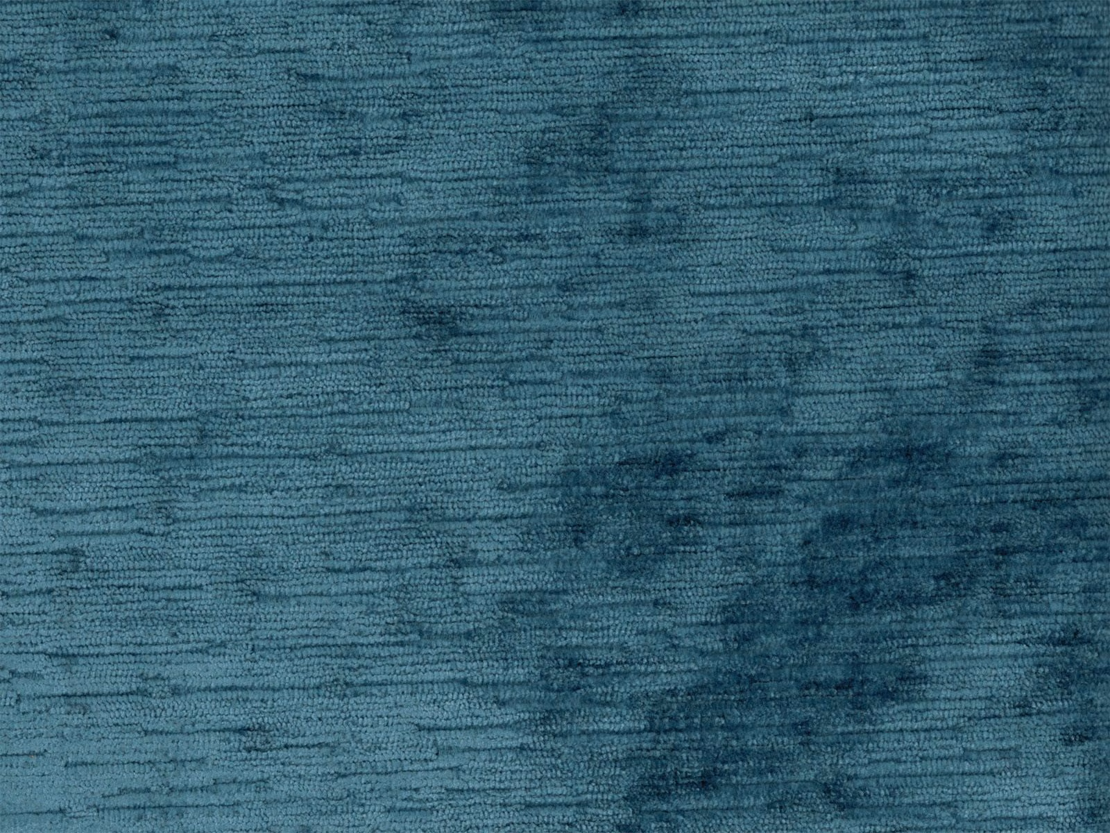Deep blue-teal velvet with mottled shading and fine horizontal pile texture