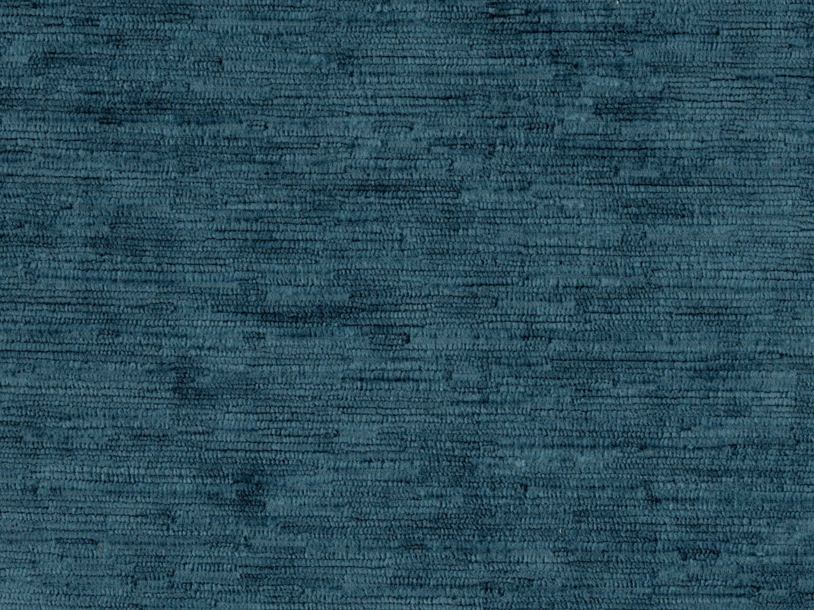 Close-up of deep teal velvet with fine horizontal tonal striations