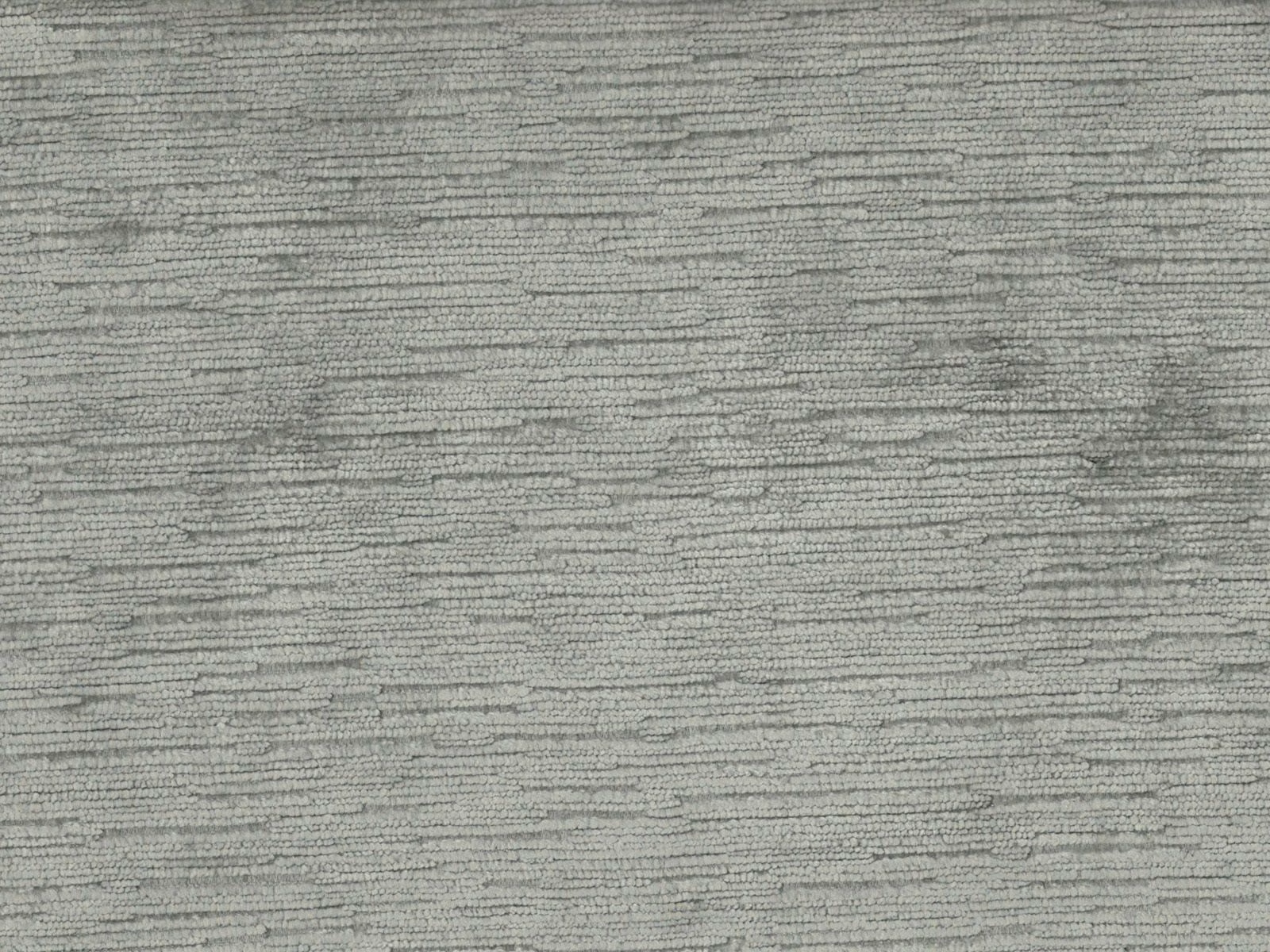 Soft grey-green velvet with fine horizontal striations and a gently varied pile