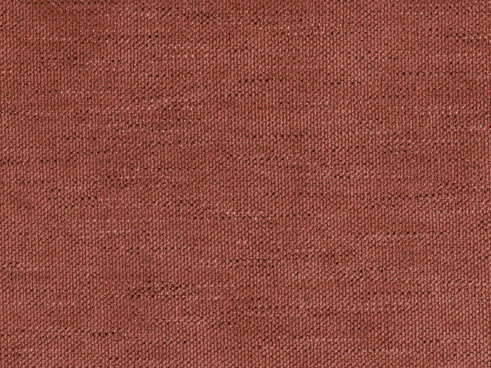 Close-up of warm terracotta-rose chenille with a fine, softly mottled weave
