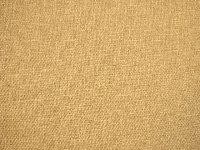 Warm honey-beige faux linen with a fine, softly varied woven texture