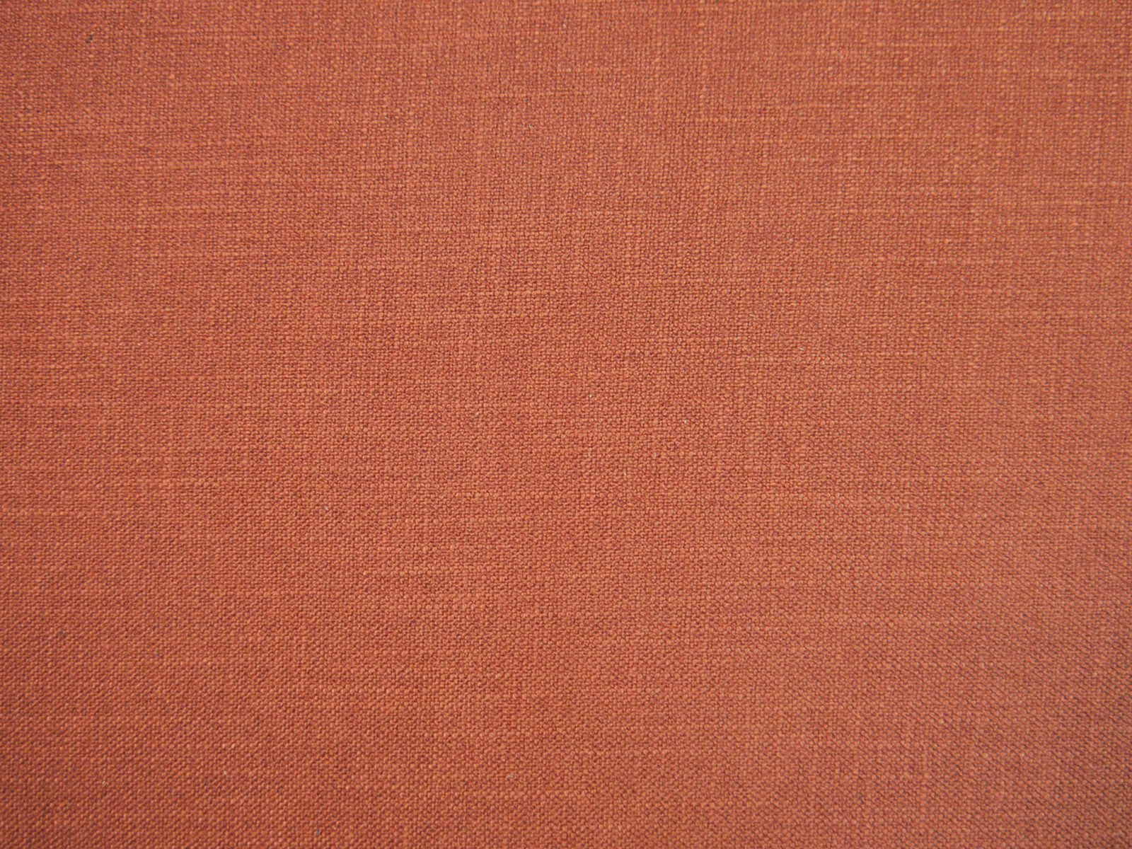 Muted rust terracotta faux-linen weave with fine tonal texture