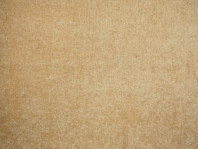 Warm sand-beige chenille swatch with fine mottled woven texture and camel tonal flecks