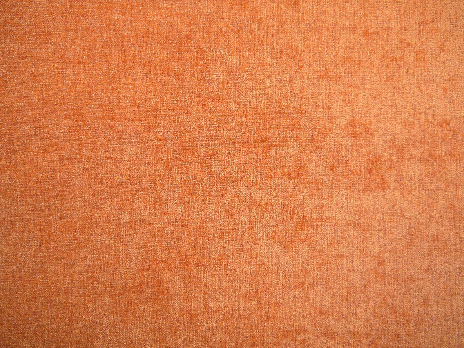 Burnt terracotta chenille with fine mottled texture and subtle tonal variation