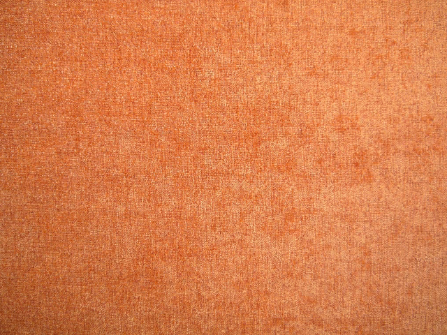 Burnt terracotta chenille with fine mottled texture and subtle tonal variation