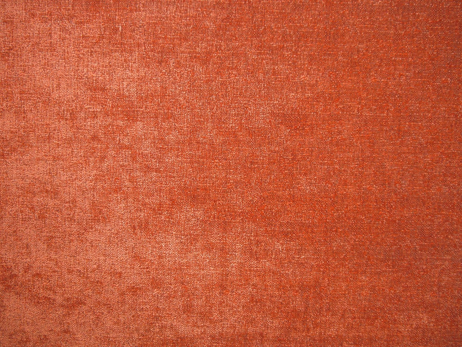 Mottled terracotta-red chenille with softly brushed texture and subtle woven tonal variation