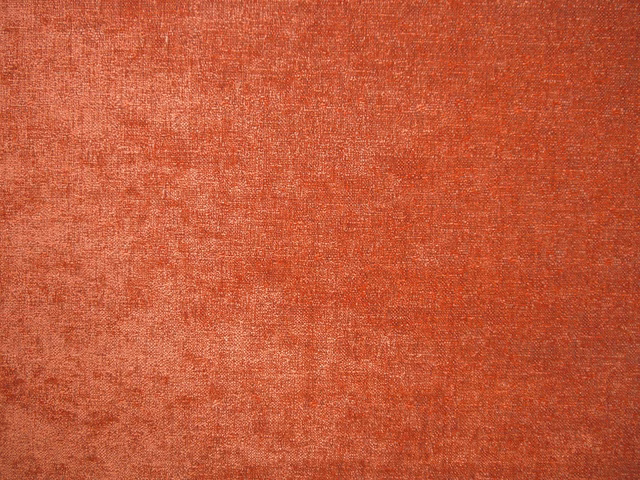 Mottled terracotta-red chenille with softly brushed texture and subtle woven tonal variation