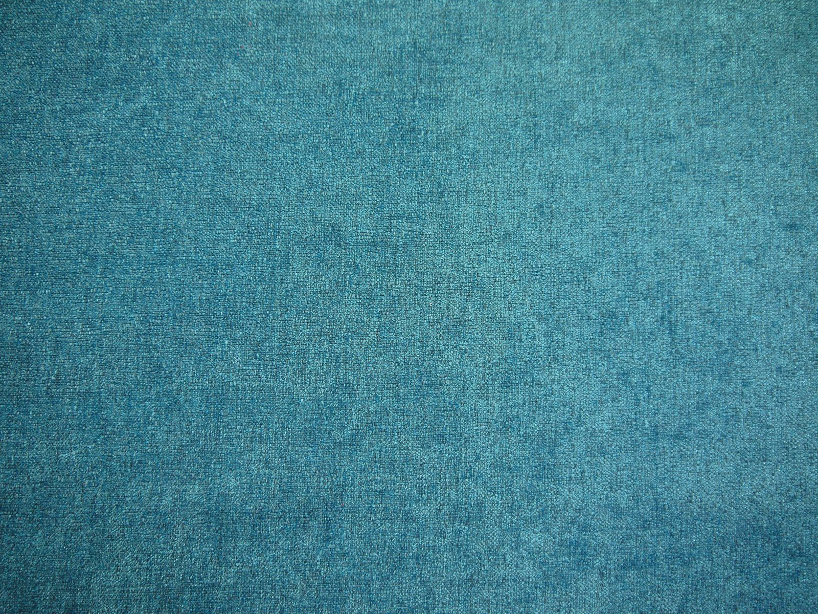 Mottled teal chenille with a soft, close-woven surface and subtle tonal variation