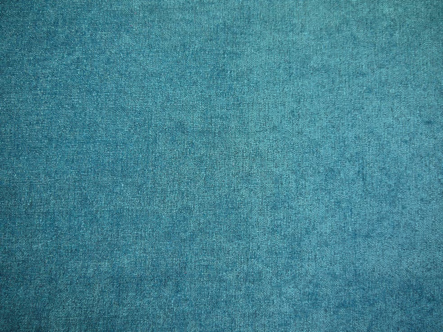 Mottled teal chenille with a soft, close-woven surface and subtle tonal variation