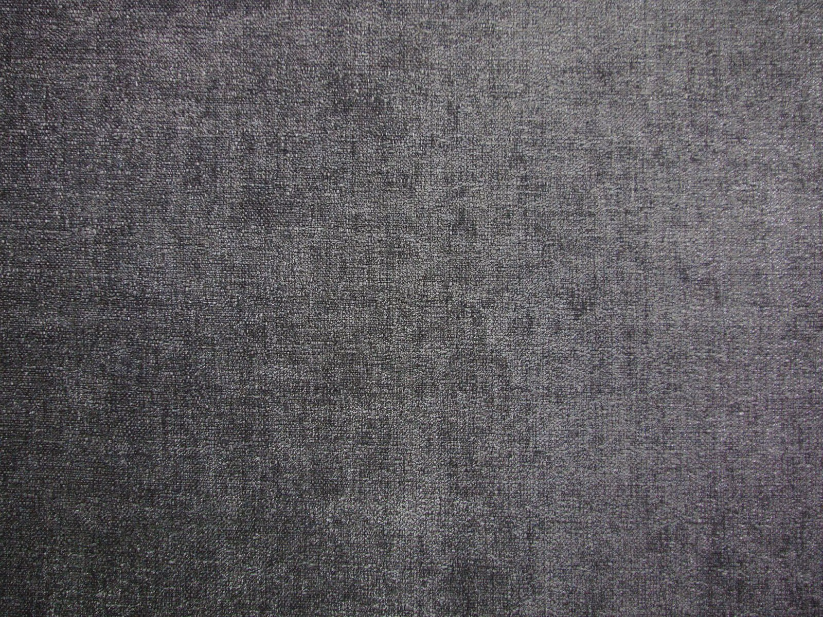 Dark charcoal-grey chenille with a finely mottled woven texture catching the light
