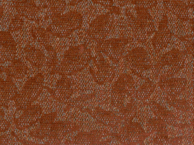 Rust-terracotta chenille with pale flecks and irregular abstract woven texture