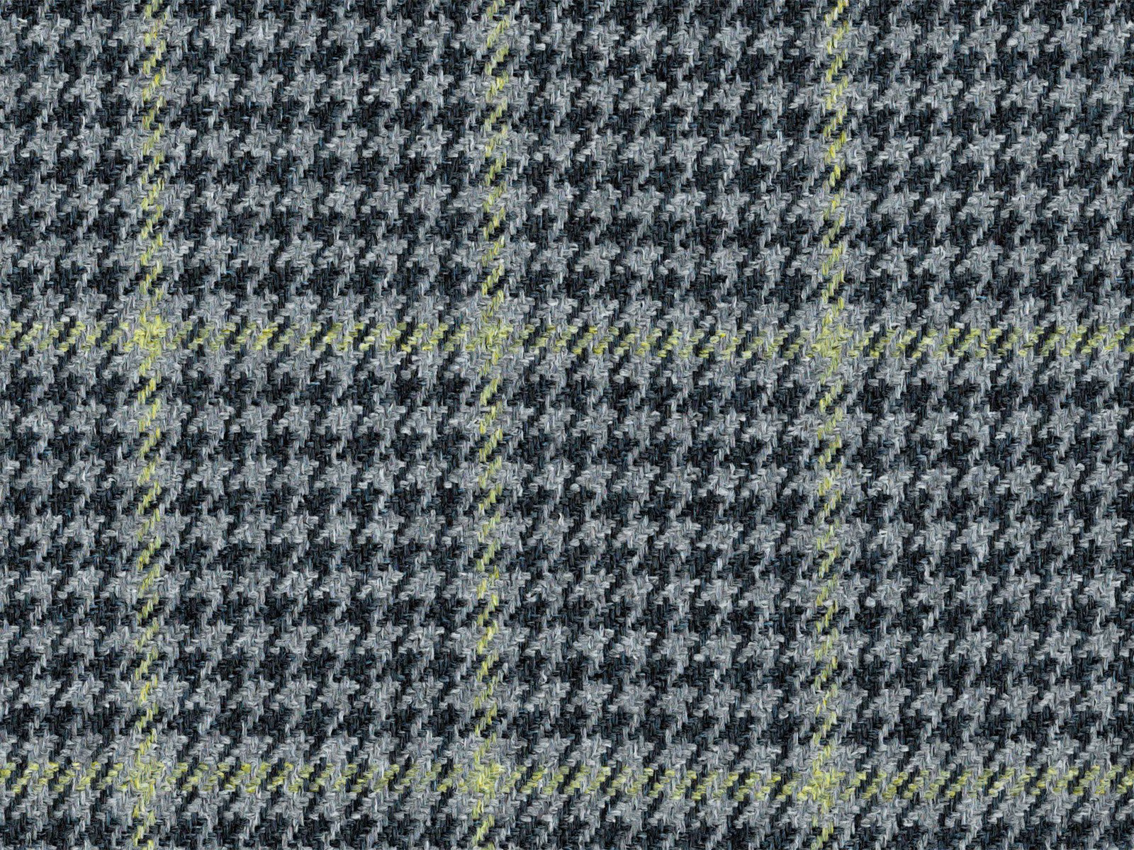 Charcoal and black broken check with acid-lime green flecks in a flat weave