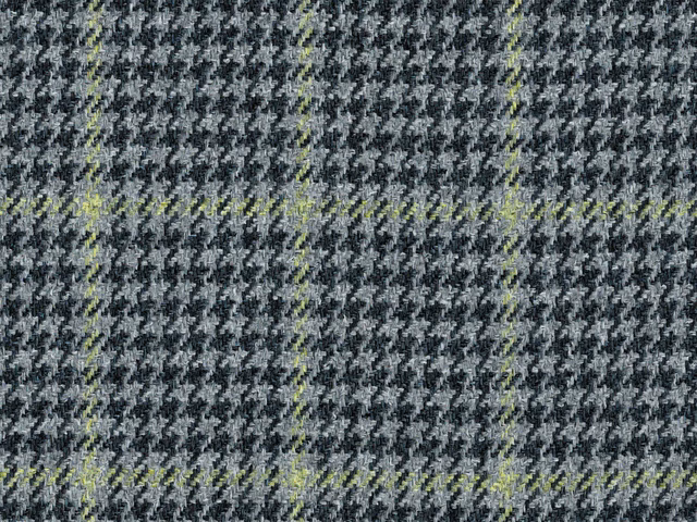 Charcoal and black broken check with acid-lime green flecks in a flat weave