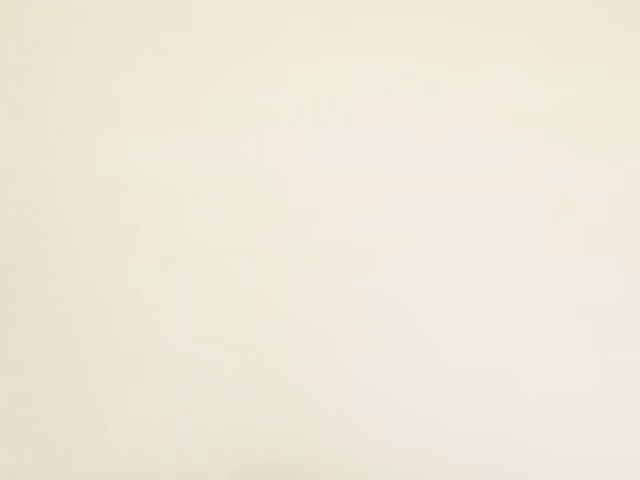 Pale ivory cream velvet with a smooth nap and softly shaded plain surface