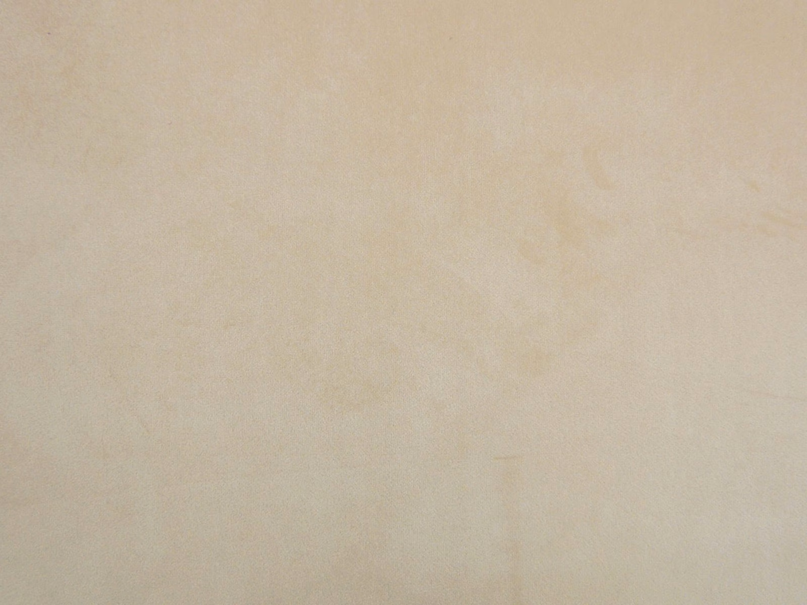 Pale warm-cream velvet with subtle cloudy mottling and a softly reflective pile