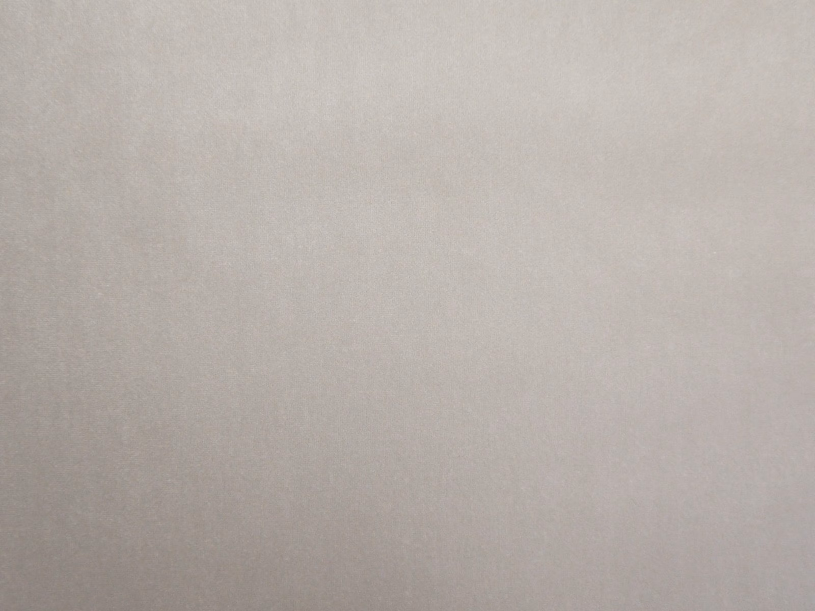 Pale warm taupe velvet swatch with a soft, subtly shifting pile