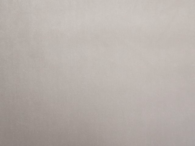 Pale warm taupe velvet swatch with a soft, subtly shifting pile