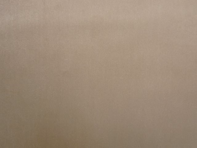 Plain warm taupe velvet with a soft nap and subtle light-catching sheen