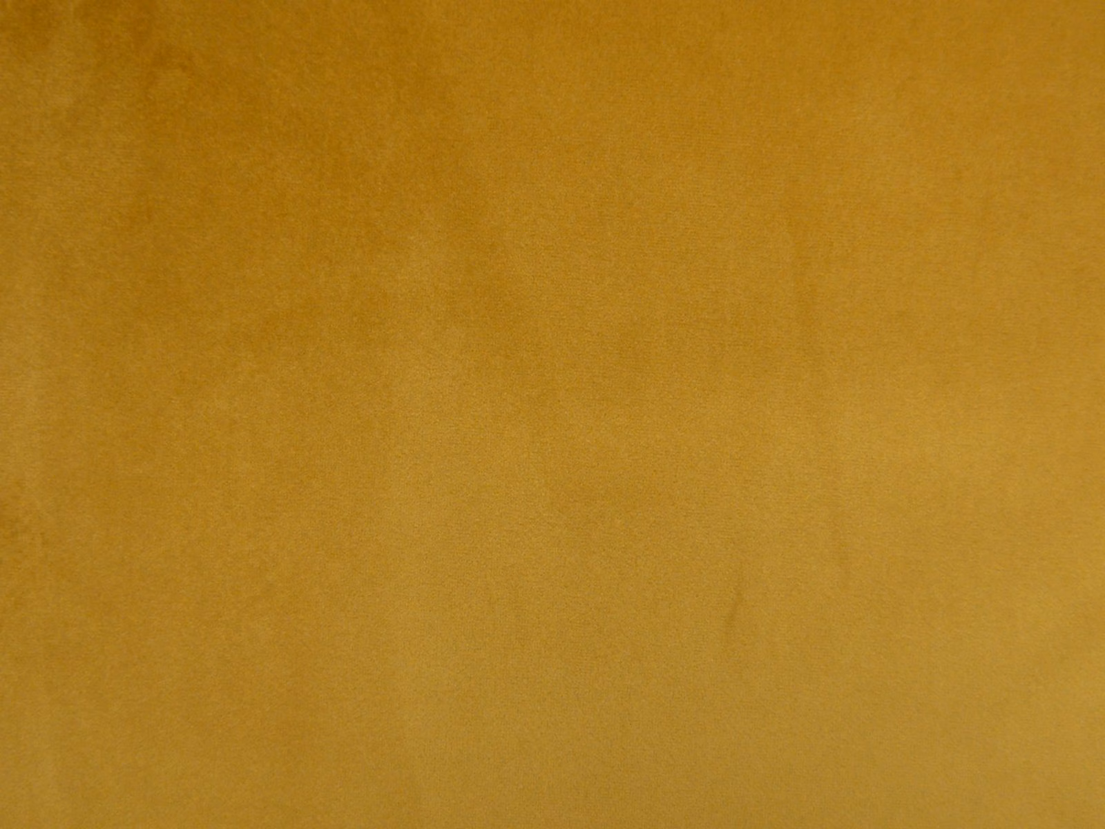 Deep ochre-gold plain velvet showing subtle nap and tonal light variation