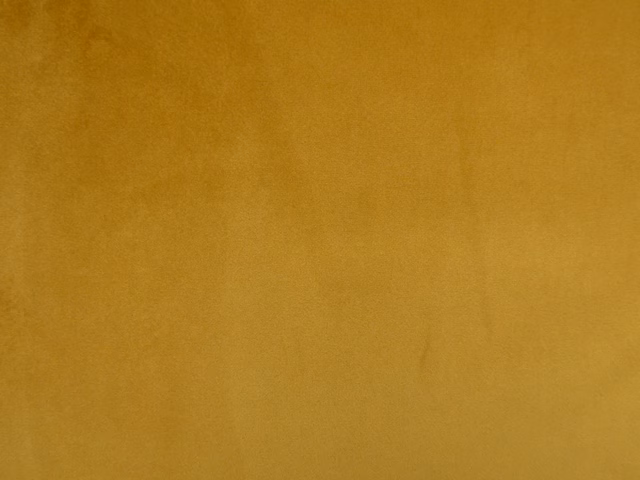 Deep ochre-gold plain velvet showing subtle nap and tonal light variation