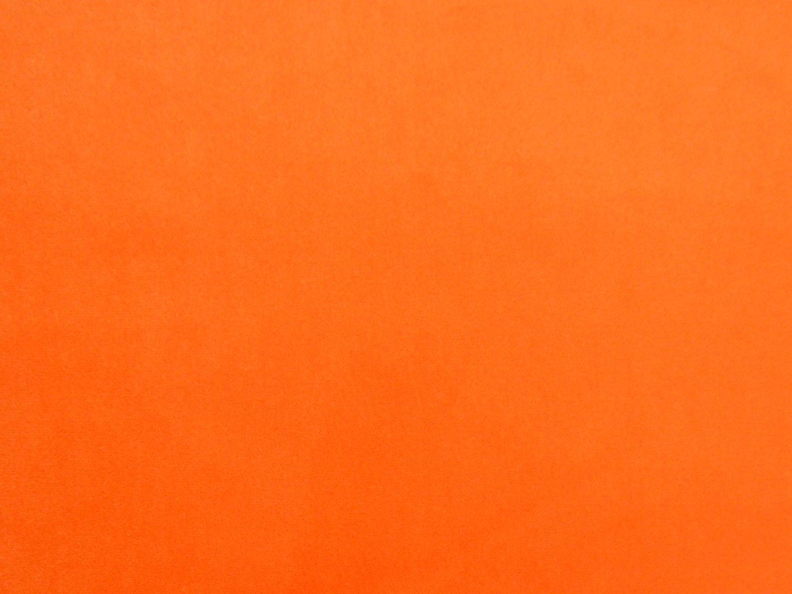 Vivid tangerine-orange velvet with subtle vertical nap shading across the swatch