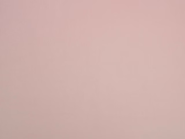 Dusty blush pink velvet showing a smooth surface and subtly shifting pile