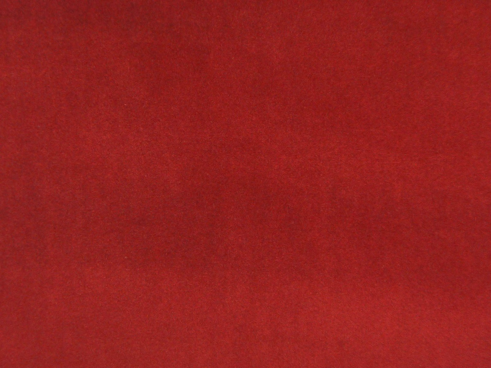 Deep crimson-red velvet swatch showing a soft, subtly shaded nap