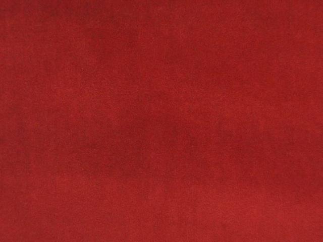 Deep crimson-red velvet swatch showing a soft, subtly shaded nap