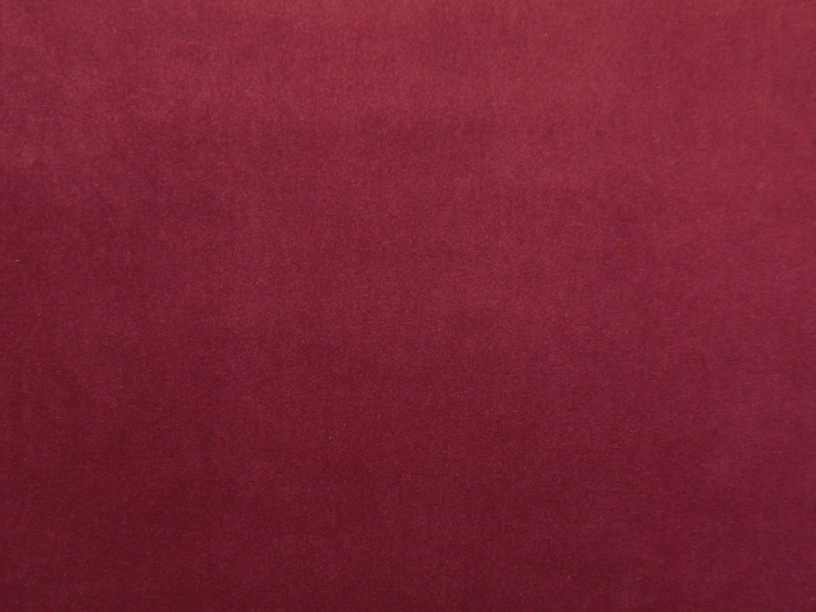 Deep burgundy plain velvet swatch showing soft pile and subtle nap variation