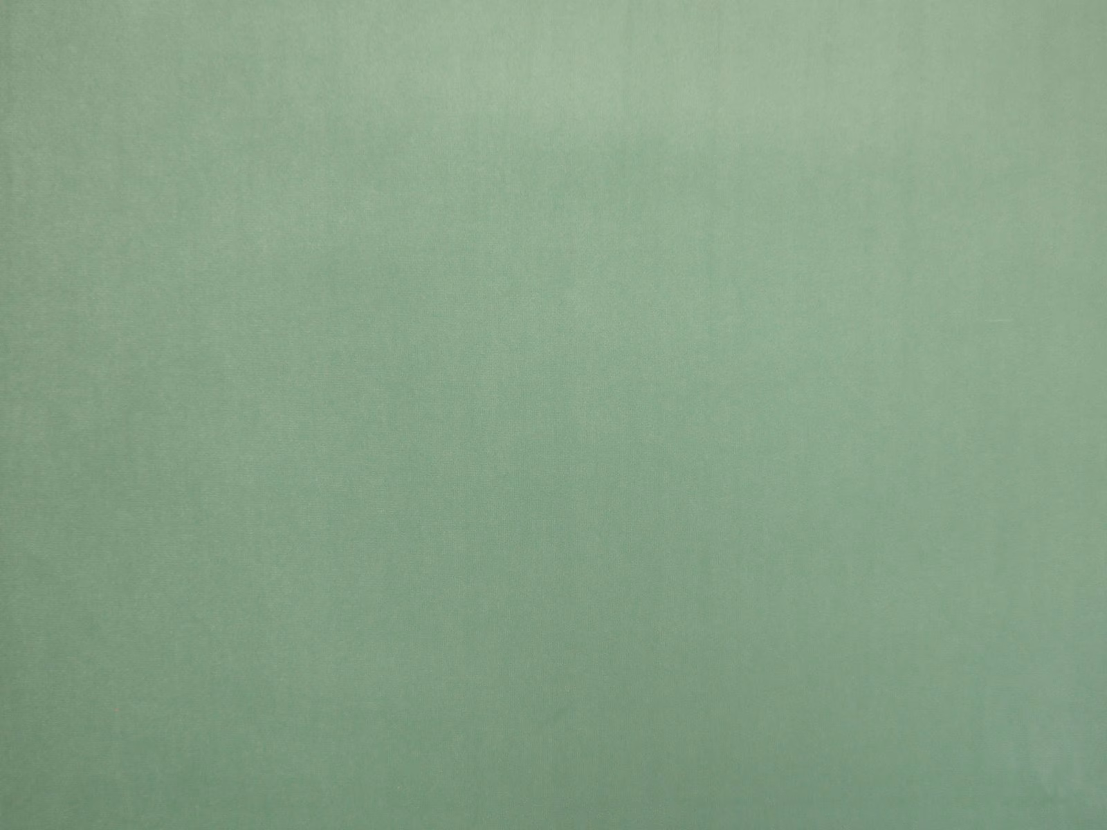 Muted seafoam teal velvet swatch showing a soft, subtly varied plain pile