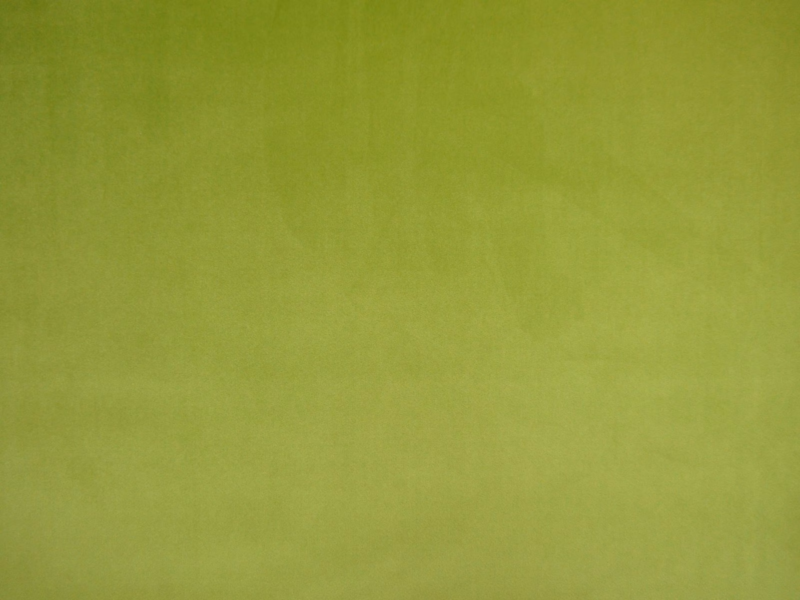 Yellow-green lime velvet with a softly mottled, light-catching pile