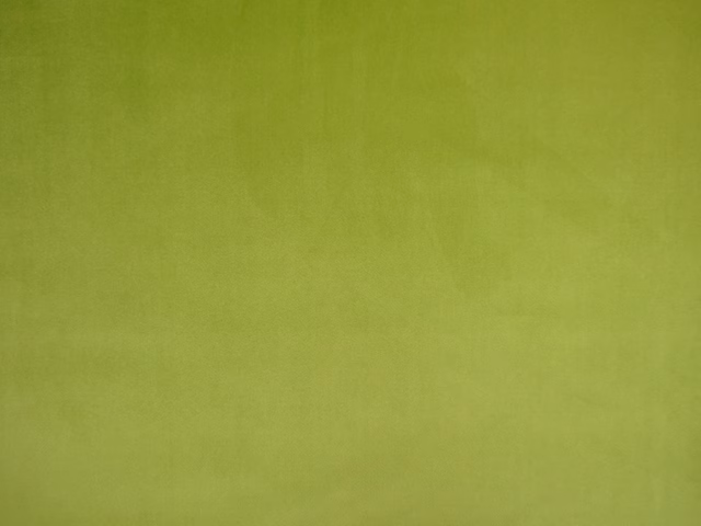 Yellow-green lime velvet with a softly mottled, light-catching pile