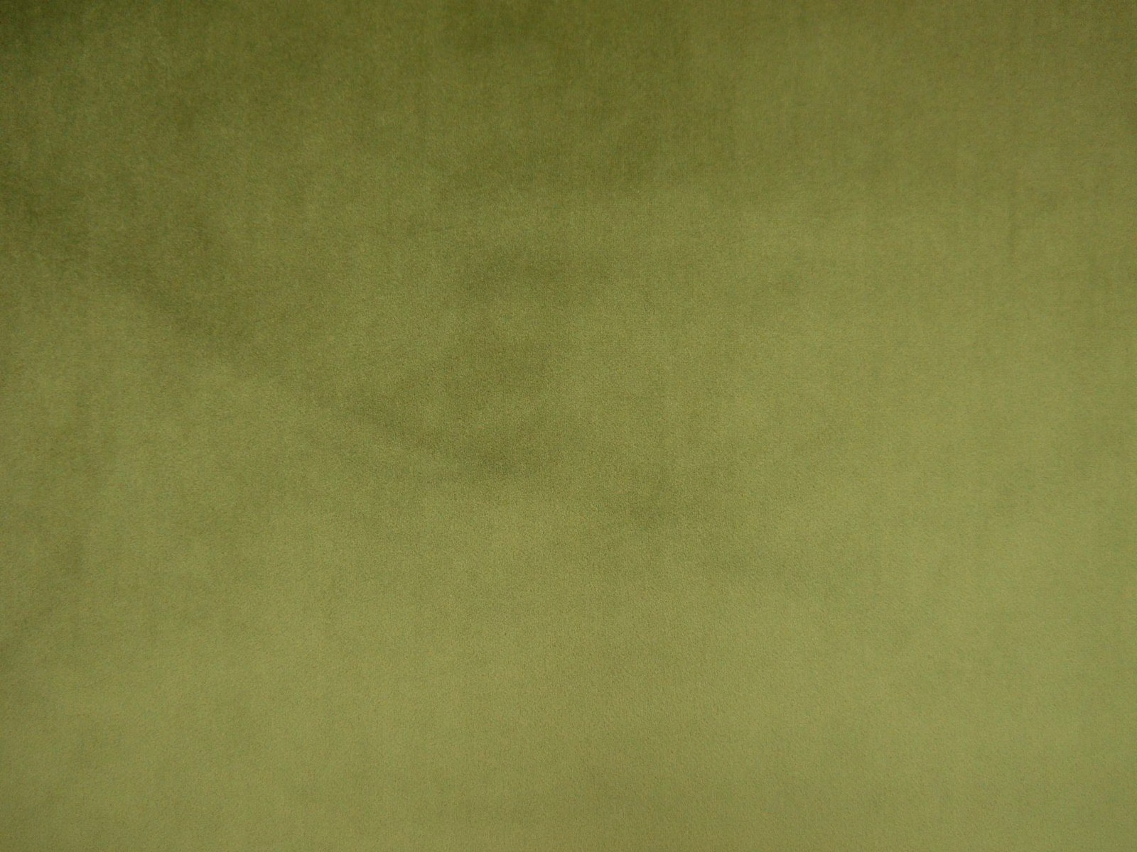 Muted moss olive-green velvet with softly shifting nap and a plain surface