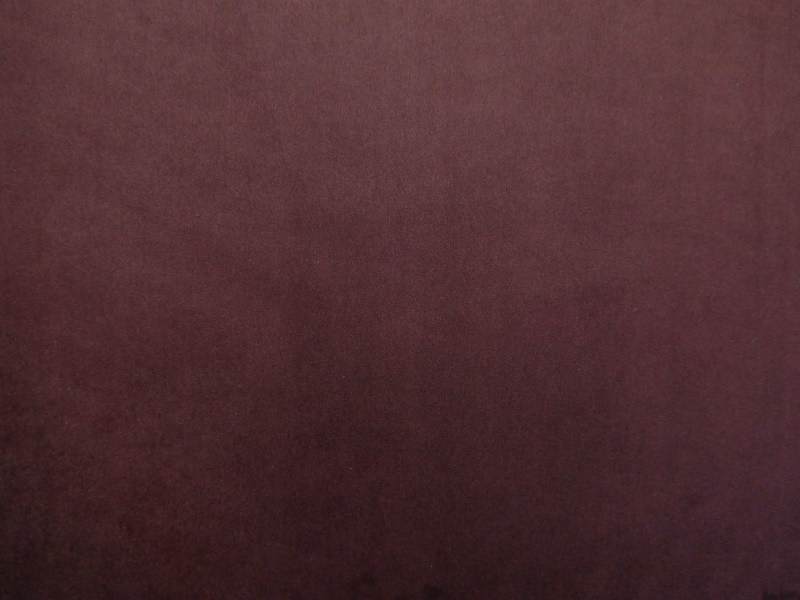 Deep burgundy velvet with softly shifting nap and subtle plum shading