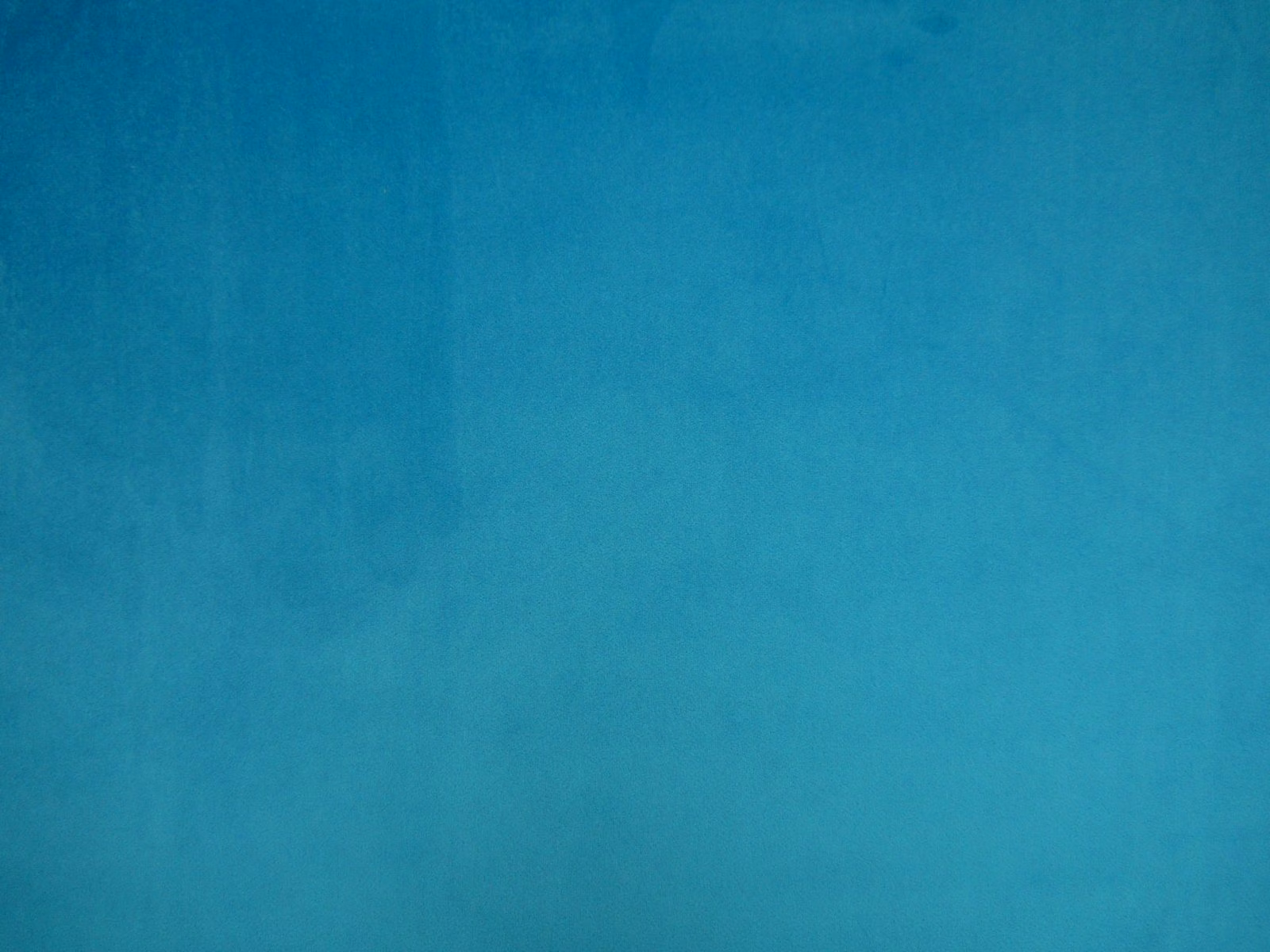 Rich turquoise teal velvet showing soft nap and subtle tonal shading