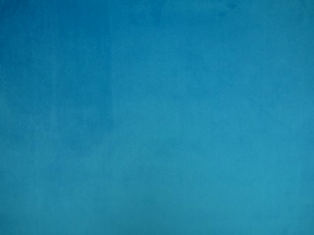 Rich turquoise teal velvet showing soft nap and subtle tonal shading