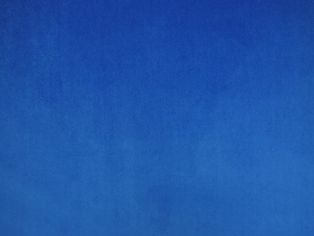 Deep cobalt-blue velvet swatch showing smooth pile and subtle tonal nap variation