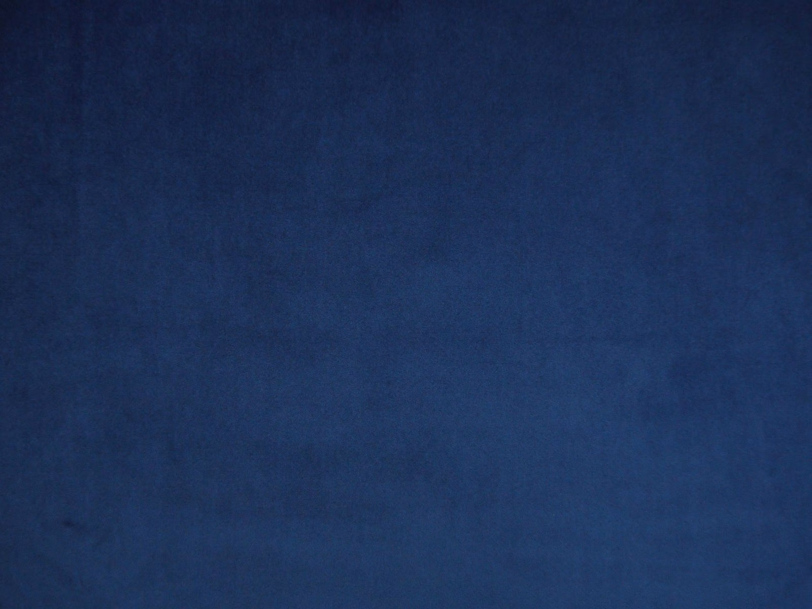 Deep ink-blue velvet swatch showing a softly brushed, subtly tonal surface