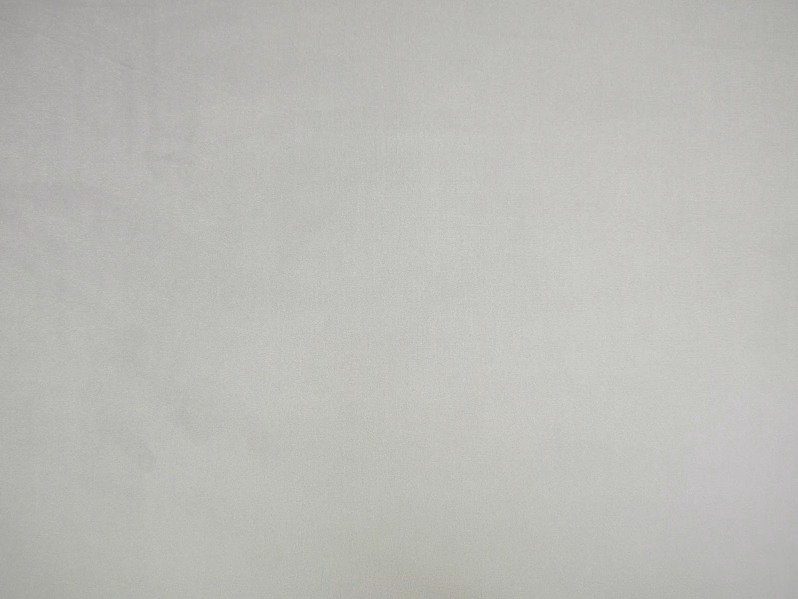 Pale silver-grey velvet swatch with a softly brushed, low-contrast surface