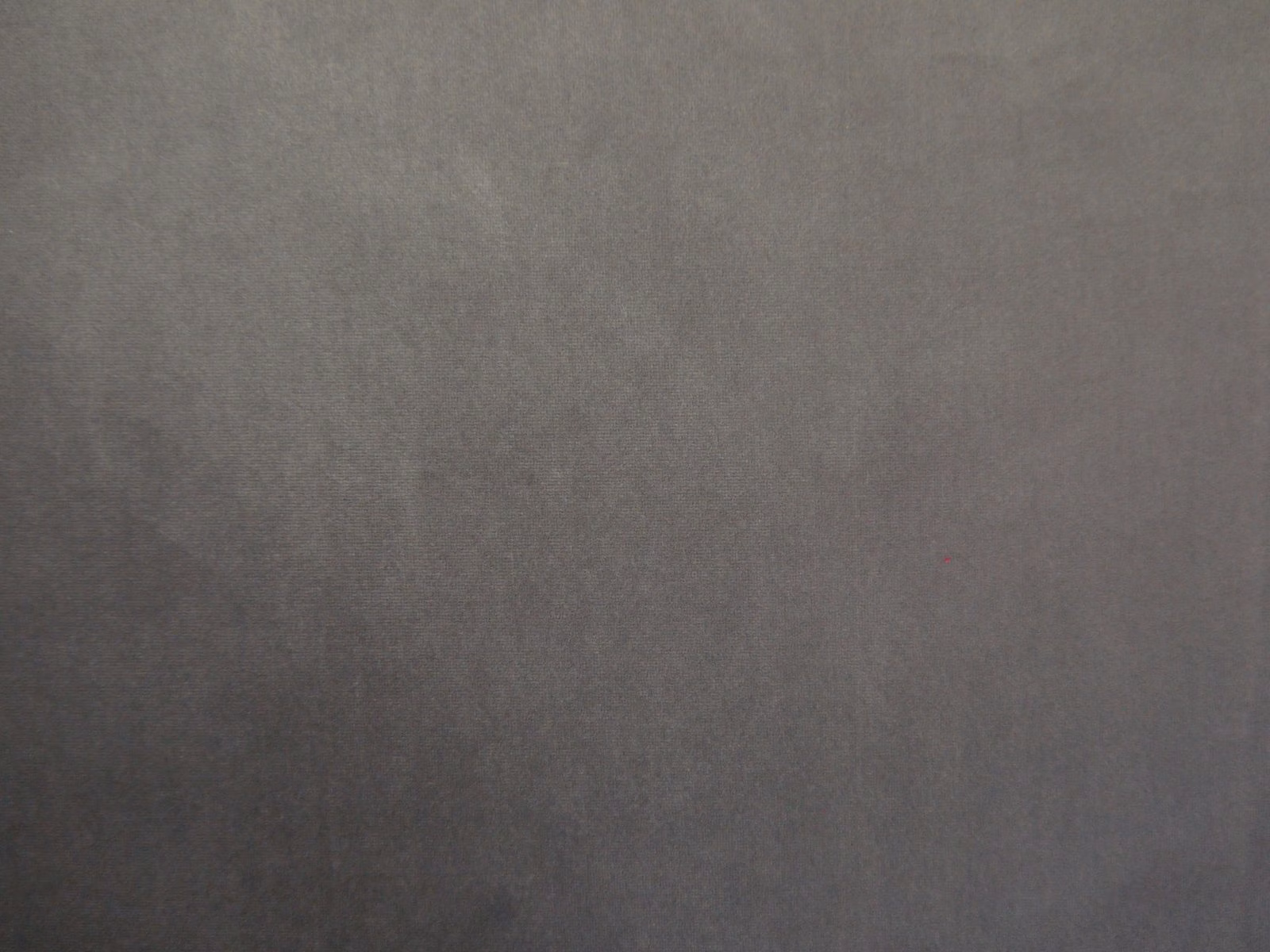 Deep charcoal-grey velvet showing a softly mottled nap and subtle directional sheen