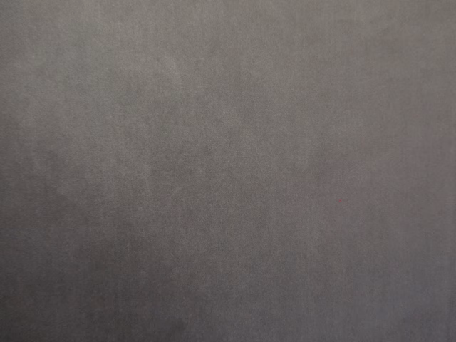 Deep charcoal-grey velvet showing a softly mottled nap and subtle directional sheen