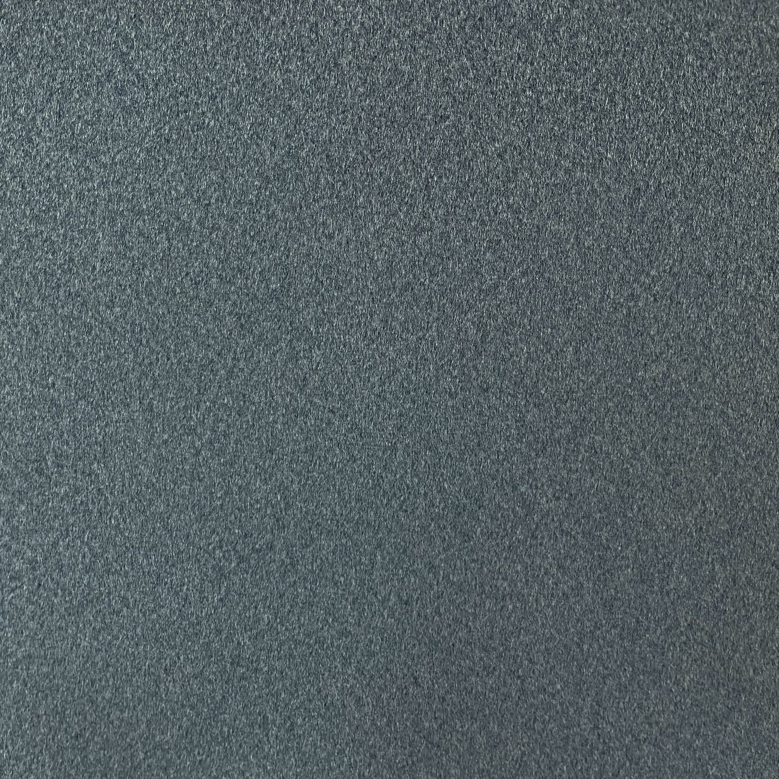 Close-up of dark blue-charcoal chenille with a softly mottled, low-pile surface