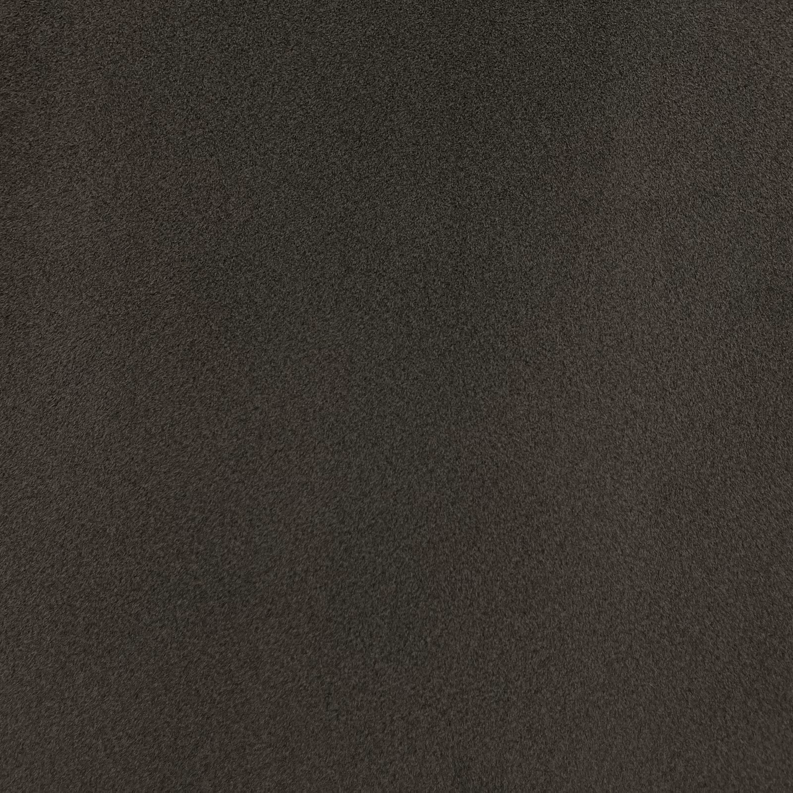 Close-up of deep charcoal-brown chenille with a softly mottled, light-catching pile