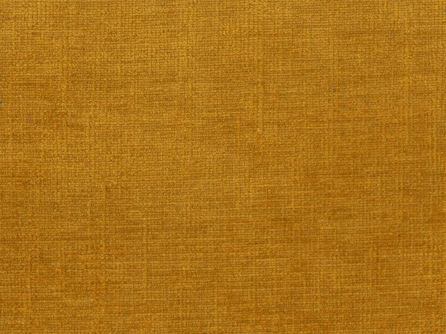 Close-up of warm ochre-gold chenille with fine irregular woven texture