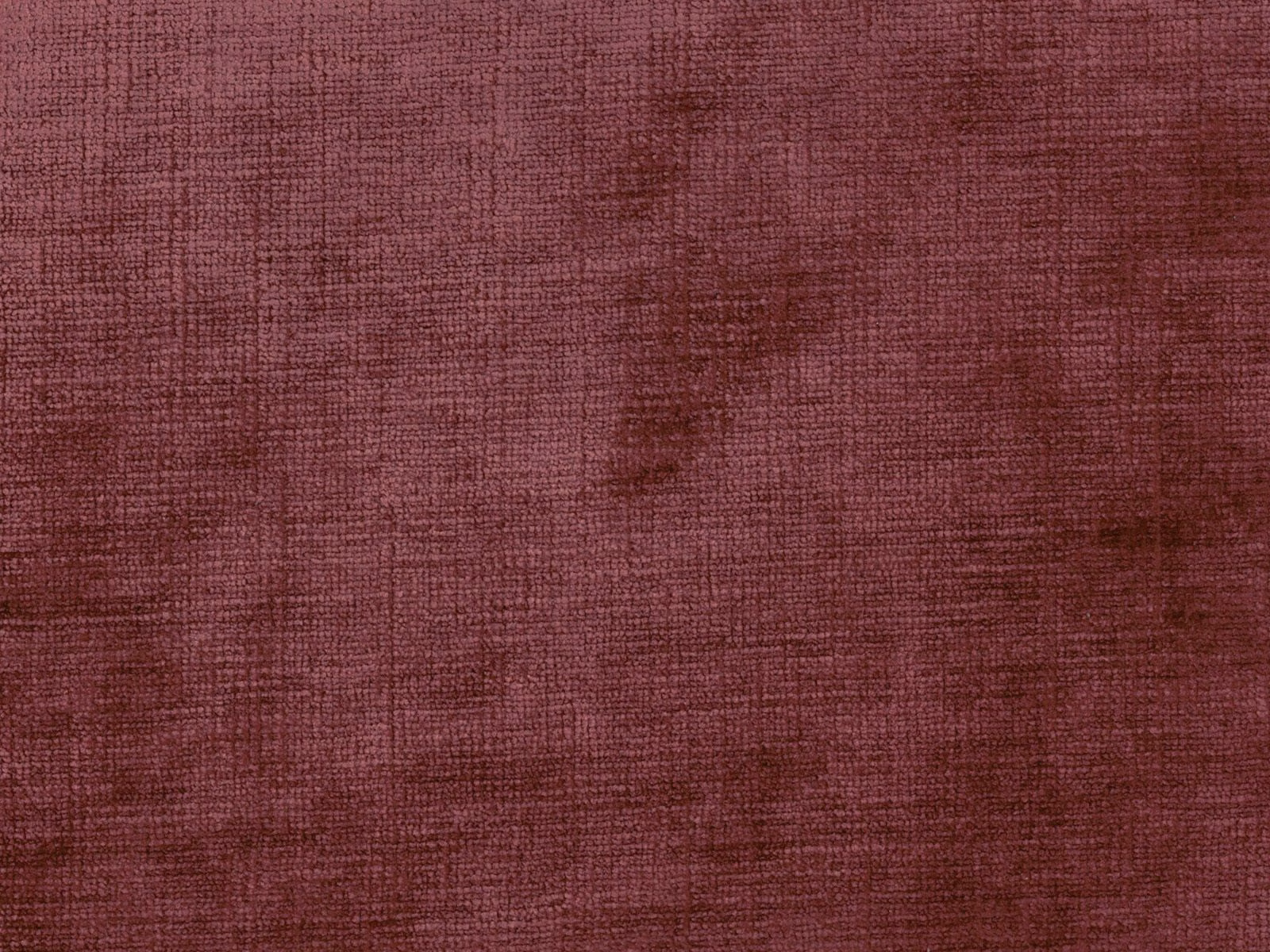 Dusky berry-red chenille with fine crosshatched weave and subtle tonal variation