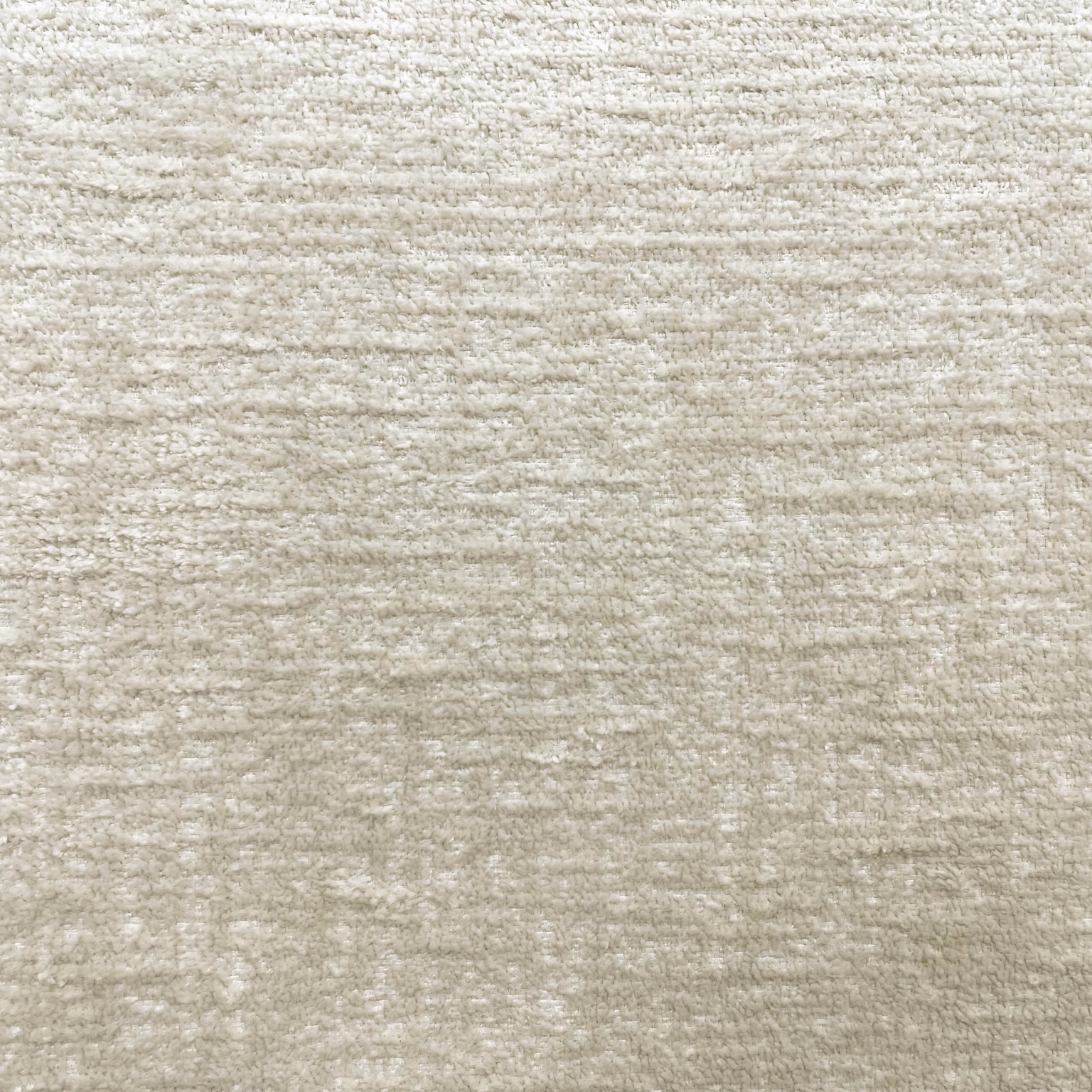 Pale warm greige chenille with softly mottled horizontal texture and subtle woven variation