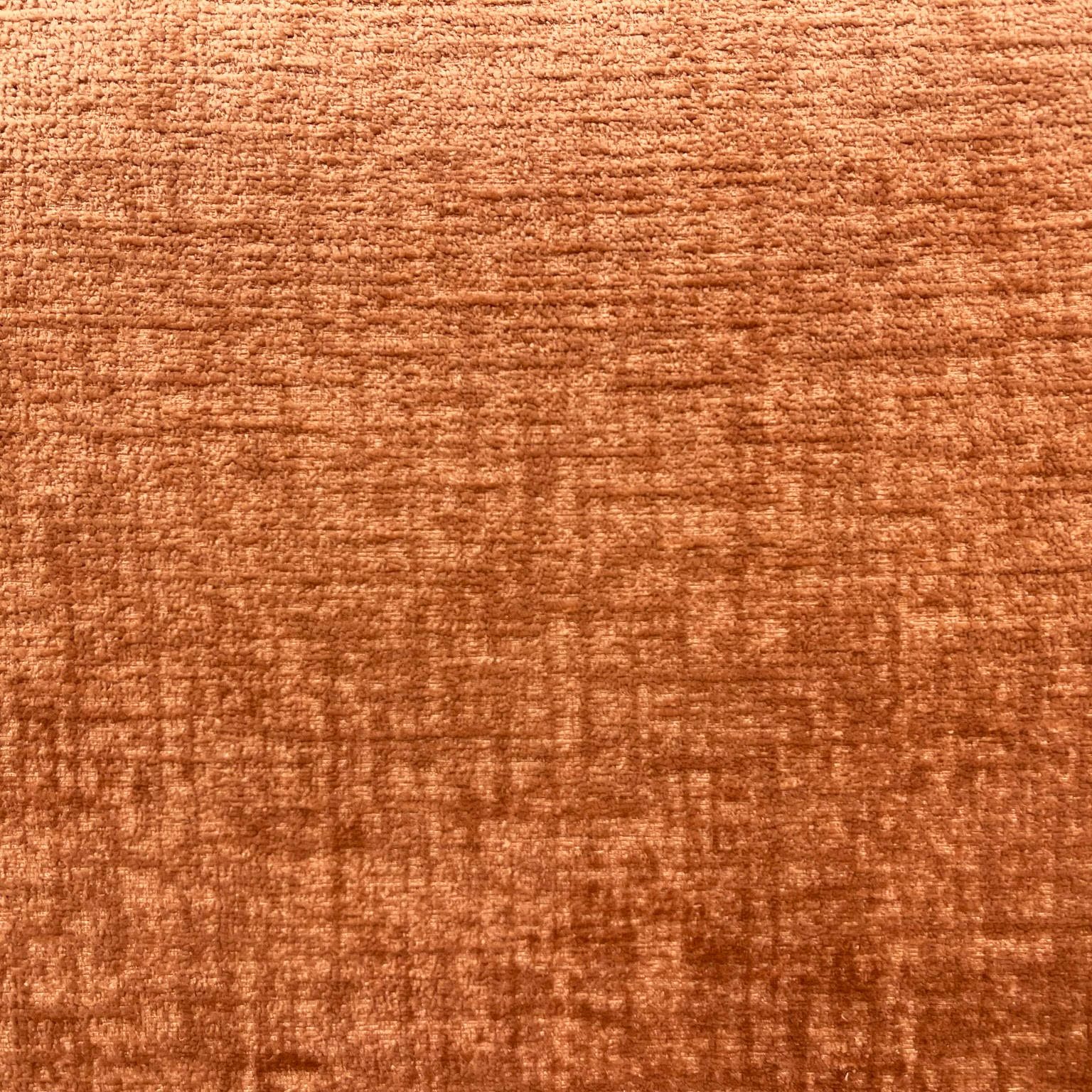 Burnt terracotta chenille with soft copper shading and subtle crosshatched texture